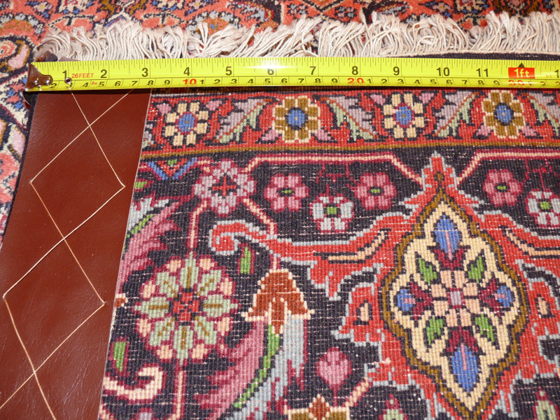 Rear view of hand-knotted Persian Bijar rug, displaying knot density and expert craftsmanship on cotton foundation.