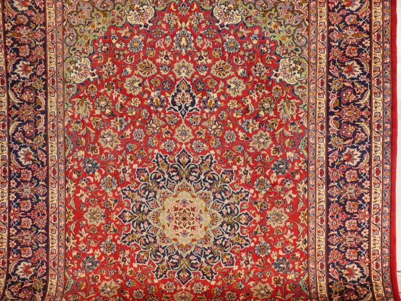 Centerpiece Detail - Persian Isfahan Rug Medallion: Get lost in the mesmerizing intricacies of the medallion at the heart of this 9'8 x 13'7 Persian Isfahan rug, a testament to masterful craftsmanship