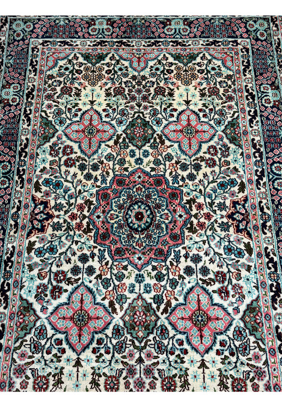 Central field of a 3 x 5 Persian Qum Silk Rug, showcasing the detailed medallion and surrounding floral motifs.