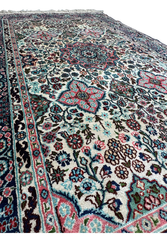 Side view of a 3 x 5 Persian Qum Silk Rug, displaying the texture and intricate weaving.