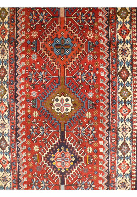 Close-up of geometric patterns on the 3' x 14' Persian Geometric Yalameh Rug
