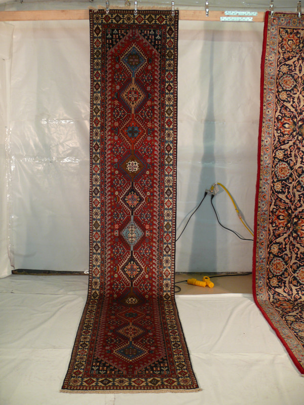 Elegant 3' x 14' Persian Geometric Yalameh Rug laid flat, showcasing high-end soft wool texture