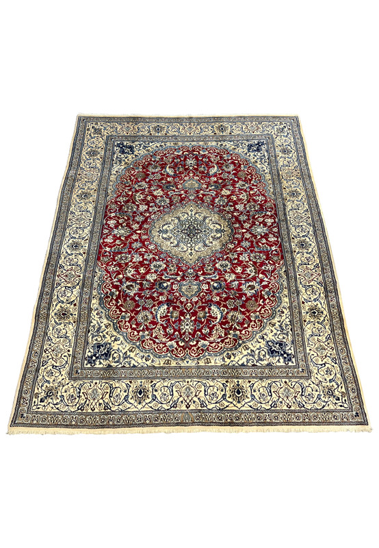 Top view of red Persian Nain 9LA rug with ivory central medallion, navy floral details, and balanced symmetrical layout