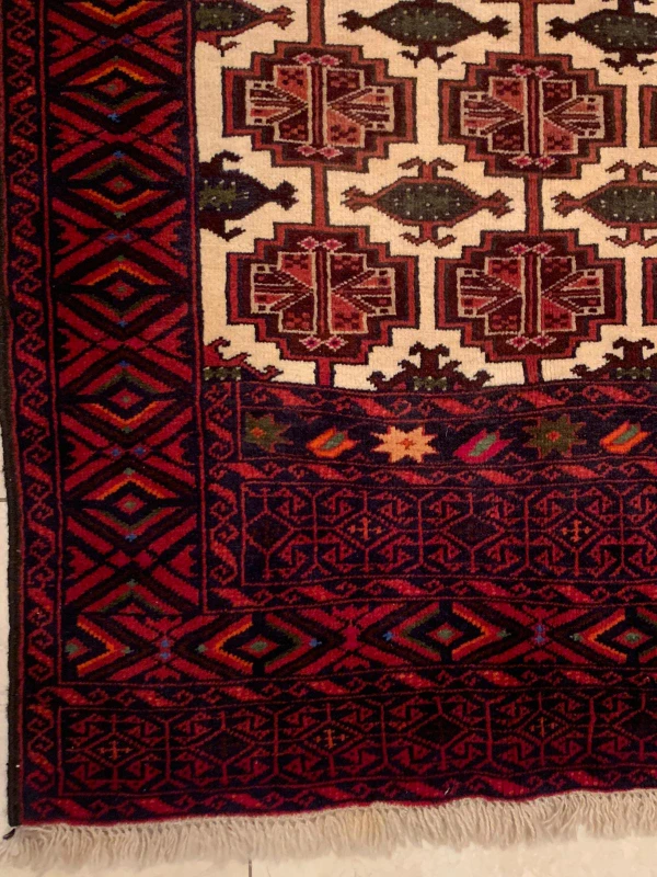 Corner and border details of the Persian Baluch Prayer rug