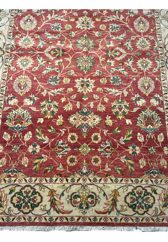 Elegant 6x9 Ziegler Rug featuring a traditional oriental pattern with a deep burgundy backdrop and a harmonious border, demonstrating the unique artistry of handmade rugs