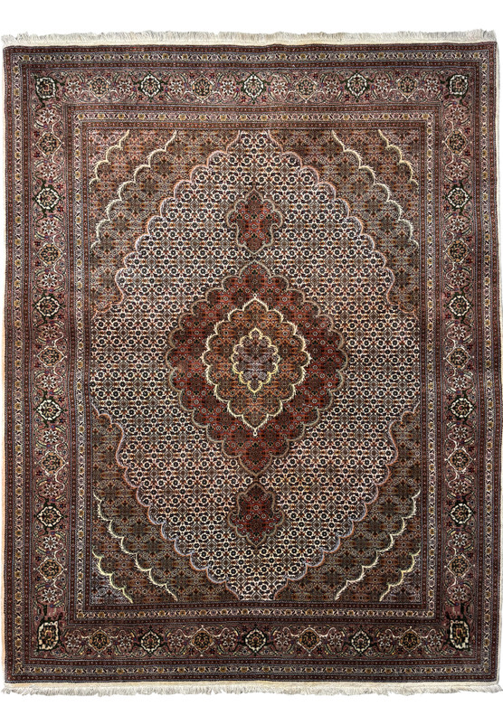 Full view of a 5x7 Persian Tabriz Mahi rug laid out flat, displaying the detailed central medallion, elaborate corner brackets, and the ornate border design with a cream fringe.
