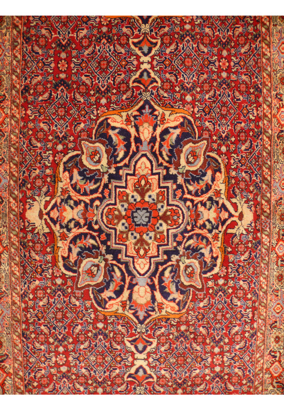 Close-up of the central medallion of the Persian Bijar Runner highlighting the unique and intricate pattern
