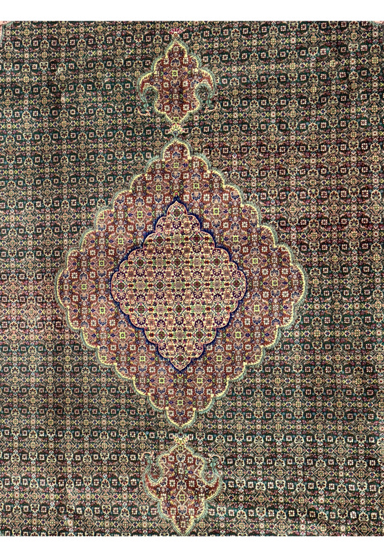 Close-up of the delicate silk and wool blend in a Persian Tabriz Mahi rug