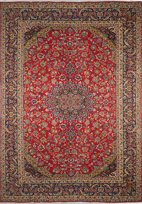 A top-down view of a 9'8 x 13'1 Persian Isfahan rug, highlighting its lush red field and dense, elaborate central medallion, surrounded by layers of detailed floral motifs and an ornate primary border with intricate guard borders