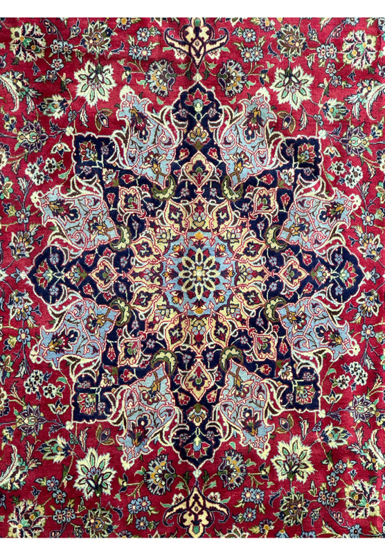 Mid-section of Persian Isfahan rug - Detailed view of the middle section of the Persian Isfahan rug, focusing on the symmetry and patterns of the design.