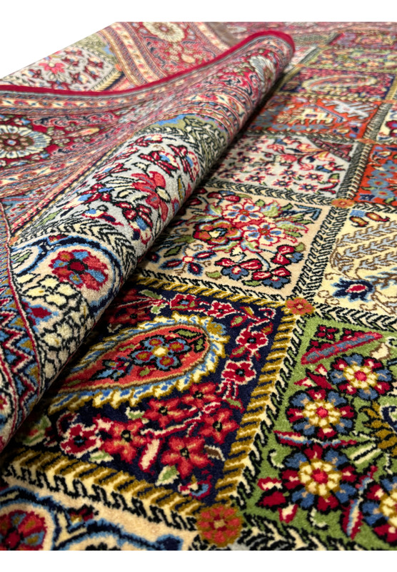 Close-up of the edge and fringe of a Persian Qum rug, showcasing the fine details and luxurious texture of the Kork wool
