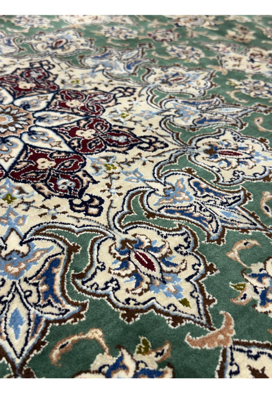 Detailed floral motifs on the 9 x 9 Nain 6LA Persian Rug