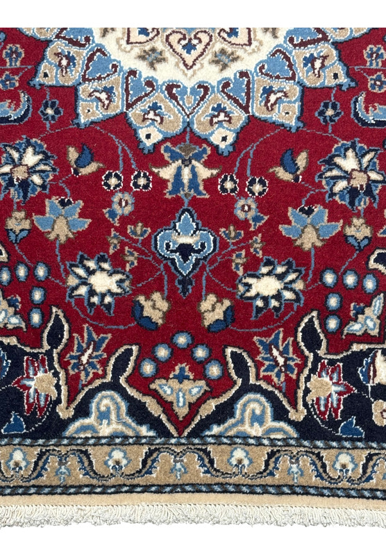 Close-up of the lower border of the 2'10" x 4'5" Red Persian Nain Rug, featuring intricate vines and flowers.