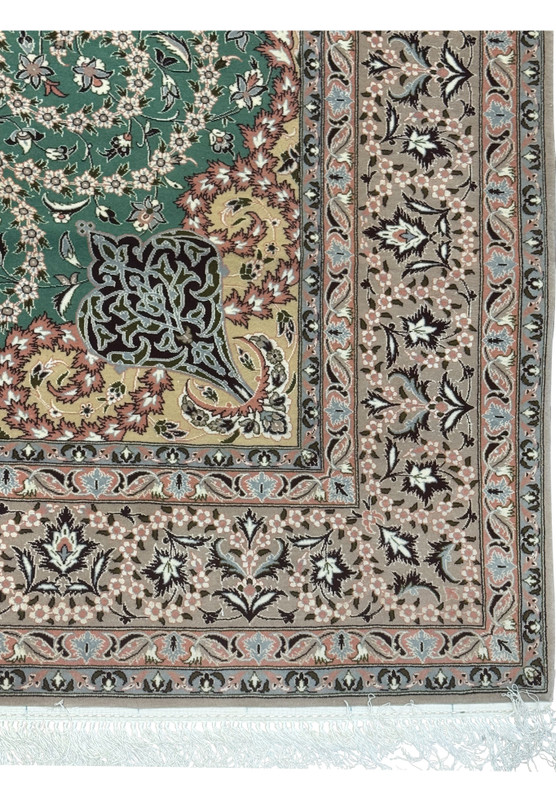 Corner detail showing arabesque motifs and floral scrolls on Isfahan rug