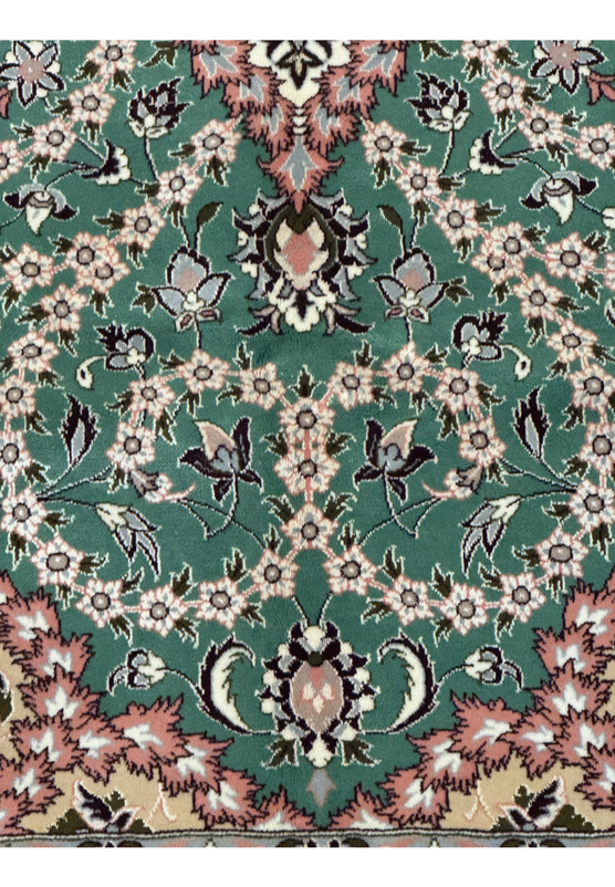 Close-up of intricate floral border design on Persian Isfahan rug