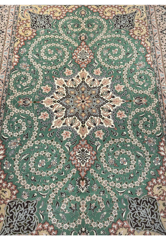 Central floral medallion of Persian Isfahan rug with silk highlights