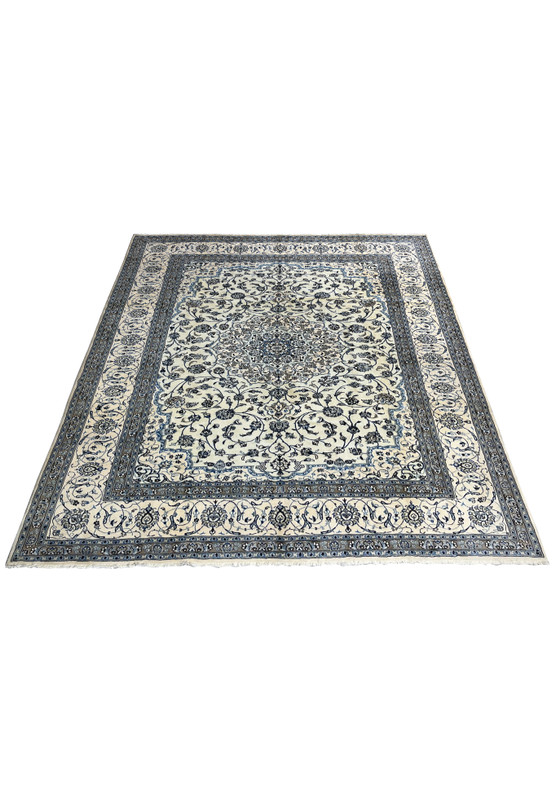 10' x 13'2 Persian Nain 9LA Rug laid flat to display ivory and blue floral pattern with central medallion and layered borders.