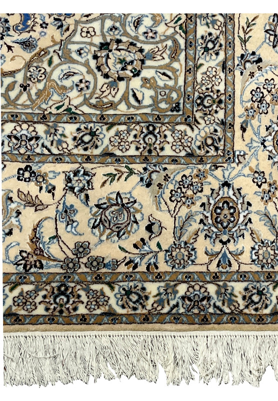 Detailed Beige border of Persian Nain rug with beige, gray, and light blue floral vines