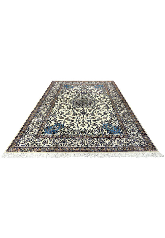 Hand-knotted Persian Nain 4 LA Habibian rug laid flat, highlighting ivory wool background, navy blue details, tan floral border, and silk accents.