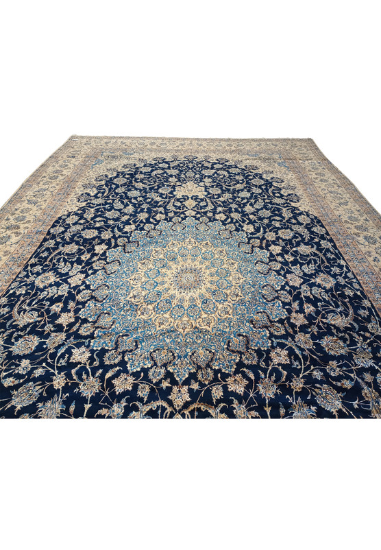 Central field of 14x25'6 Nain 9 LA Persian rug featuring large medallion in ivory and sky blue.
