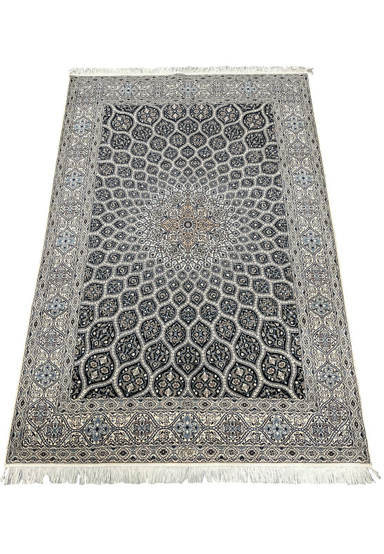 6'9 x 10 Persian Nain 6 LA Habibian rug laid down showing navy dome design ivory background silk highlighted floral motifs.