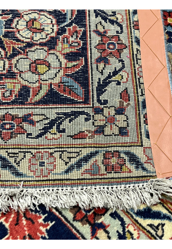 Persian Kashan rug 8x12 corner fringe detail with navy and ivory scrolling vine border