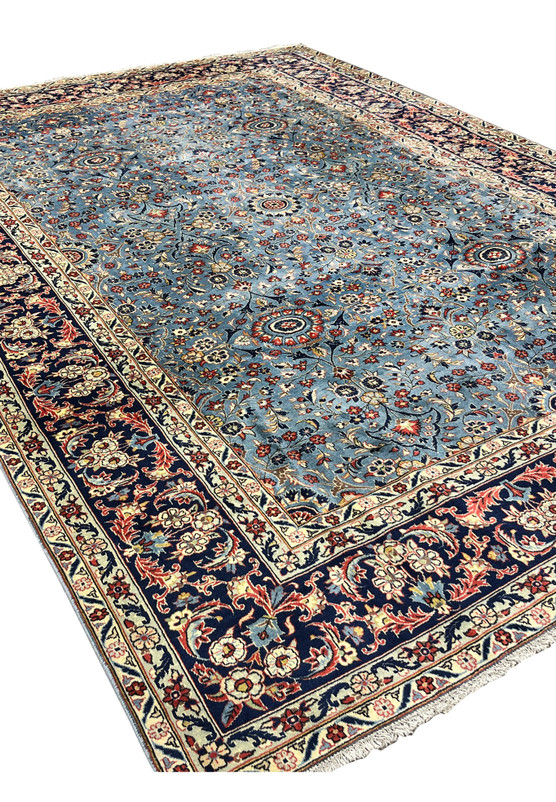 Vintage Persian Kashan rug center floral medallion detail on steel blue allover field