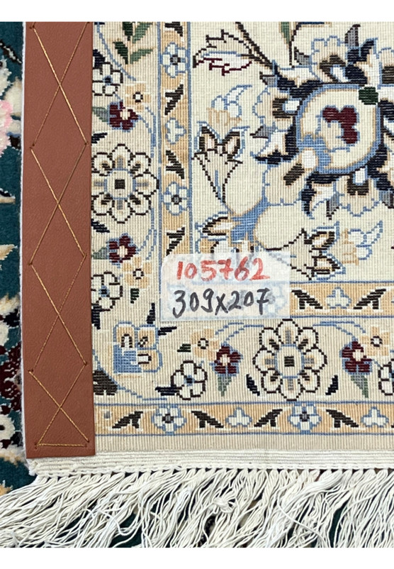 Backside of 7x10 Persian Nain 6La Habibian teal rug showing knot density and cotton foundation