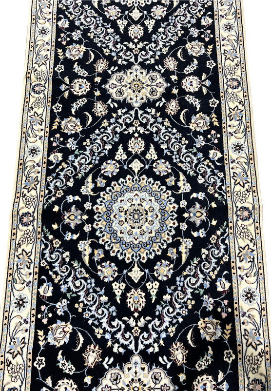 Midfield view of 3x15 Persian Nain 6La Habibian runner, diamond medallion with sky blue and ivory rosette
