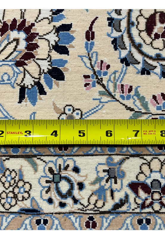 Closeup of the rug backside showing individual hand-tied knots and 600 KPSI fine weave