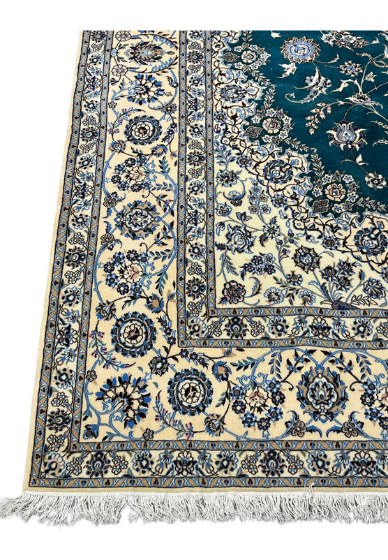Ivory main border with symmetrical palmettes and delicate vine scrolls in hand-knotted wool and silk