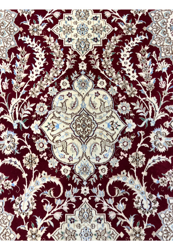 Ivory medallion with star center sky blue and sage scrollwork on rich muted red Nain ground