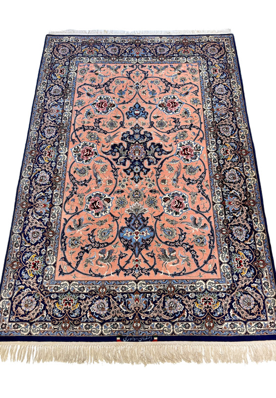 Hand-knotted Isfahan 4'2 x 6'8 with six rose cartouches, paired peacocks, and indigo center anchors on a soft salmon ground