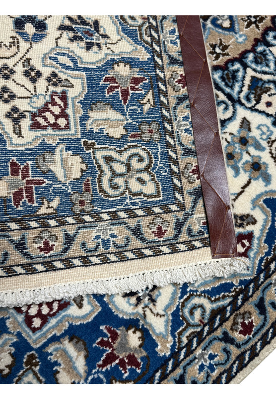 Backside of authentic Persian Nain rug showing tight knotting and wool foundation, even weave throughout