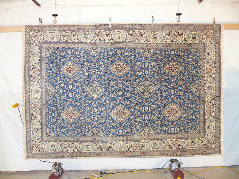 Hand-knotted wool and silk texture of the 7 x 10 Persian Nain 9 LAA rug