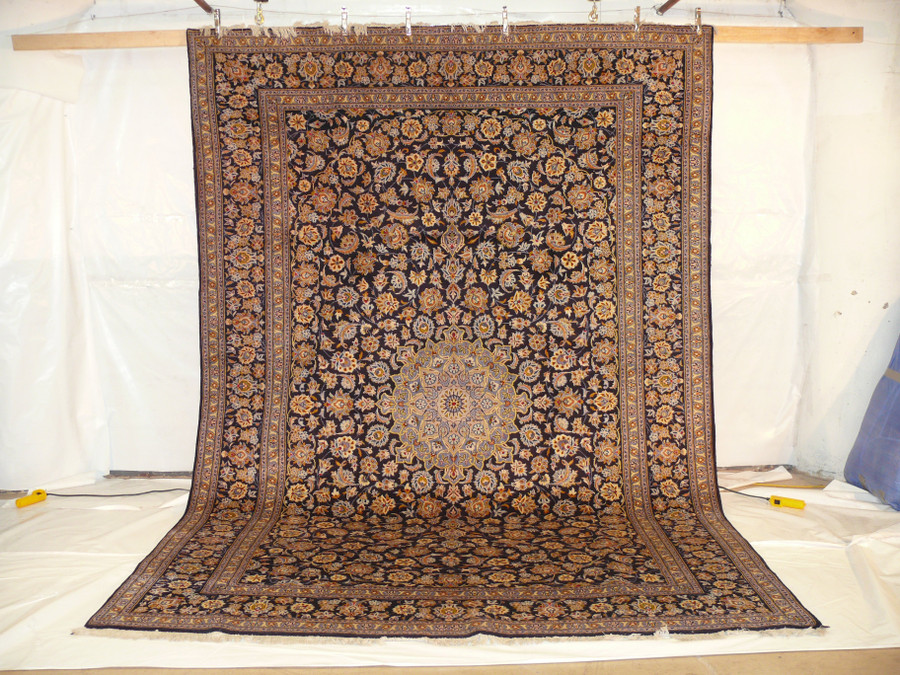 Complete Elegance - Persian Kashan Rug: Enjoy a comprehensive view of the entire 9'7 x 13'9 rug, with its harmonious blend of navy blue, floral patterns, and rich colors that make it a true work of art