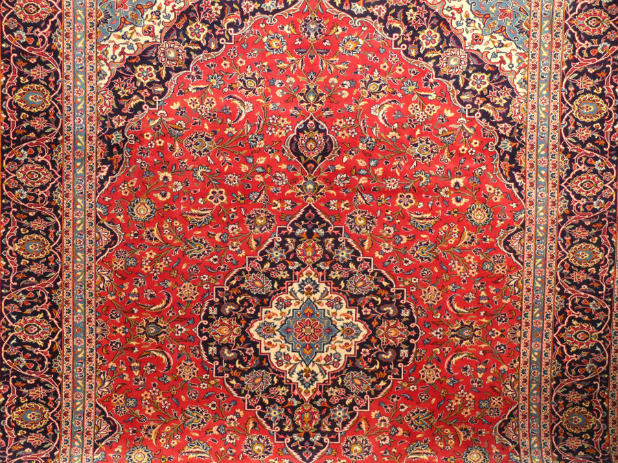 Add a touch of tradition and sophistication to your home with our 10 x 13 wool on cotton Persian Kashan rug, hand-knotted with intricate designs