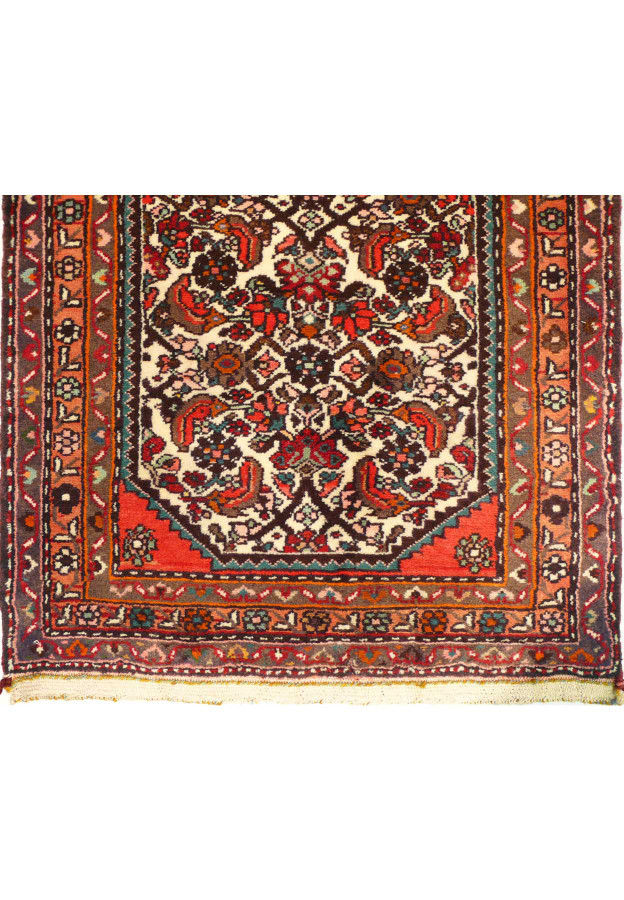Detail of the rug’s edge, highlighting the craftsmanship of the handwoven wool.