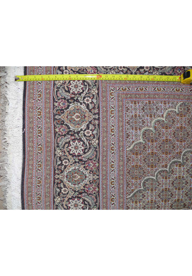 Back of the Persian Tabriz Mahi Rug with a ruler showing the high knot density for quality assurance