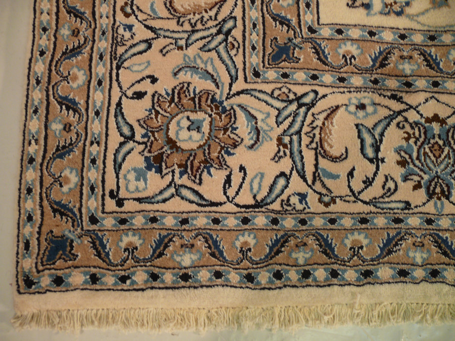 Border of a 9x12 Persian Nain Rug