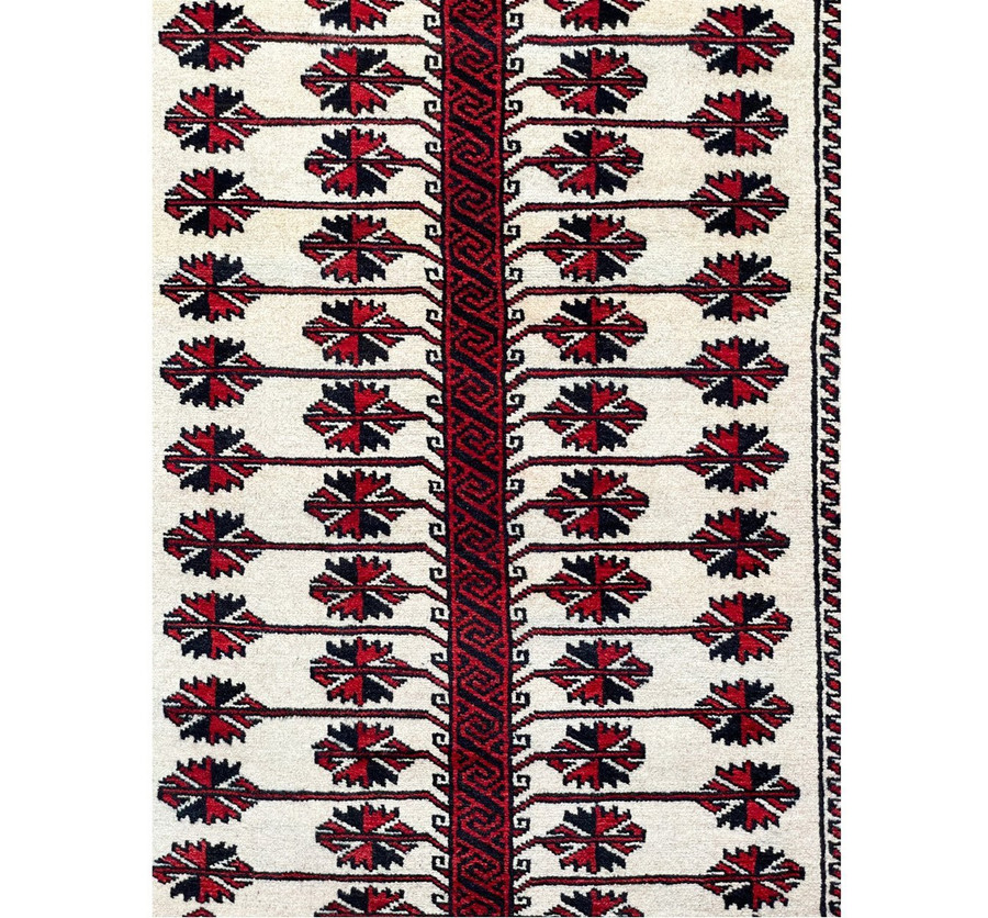 Intricate details of the Persian Baluch rug captured in a close-up shot, highlighting the unique beauty of its design