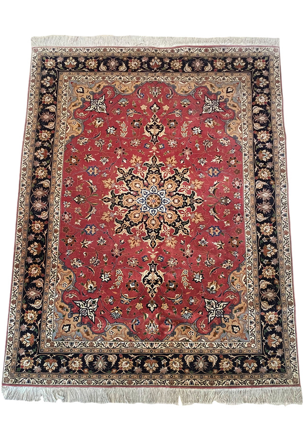 Close-up of Intricate Details and Patterns on a Luxurious Persian Tabriz Rug