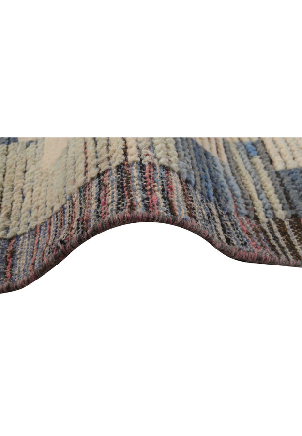 Close-up of the rug, showing the intricate weave and color transition, giving a sense of the rug's handcrafted quality.