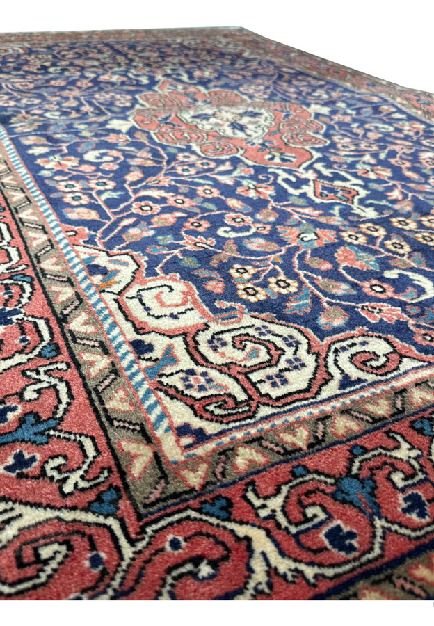 Angle view of a Vintage Persian Sarough Rug, showing the texture and plush pile of the fine wool craftsmanship.