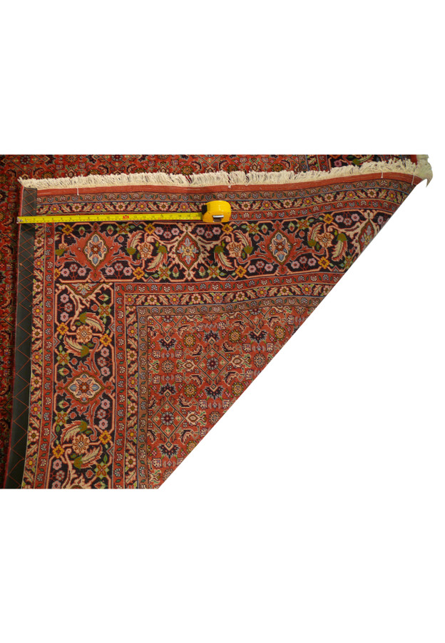 The fringe of the Persian Bijar Rug, with a measuring tape indicating its dimensions