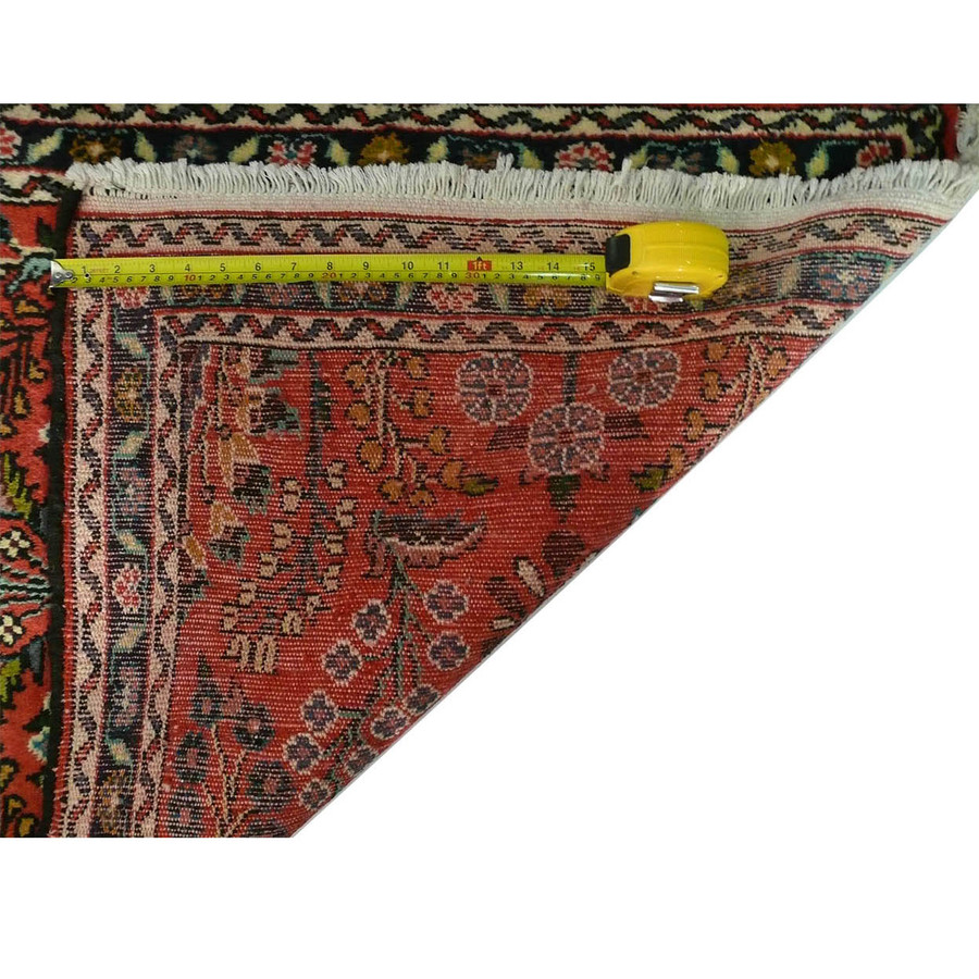 An image showing a measuring tape across the width of the Persian Darjazin runner rug, indicating its dense knots.