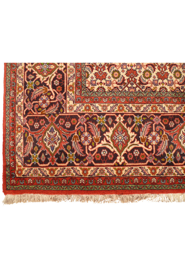 Detailed view of the intricate border design of a Persian Bijar rug, featuring traditional motifs.