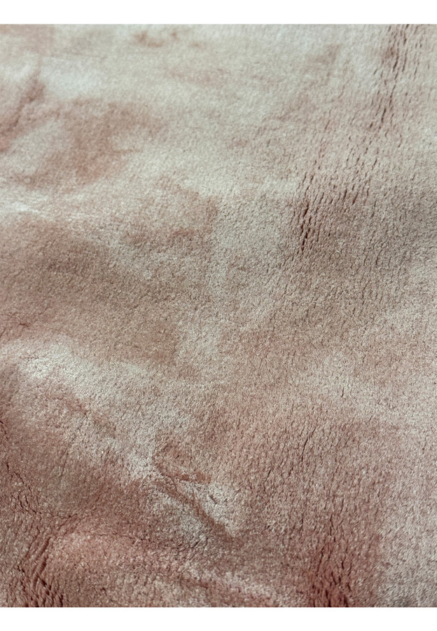 Close-up on the rug’s surface, showcasing the fine silk texture and subtle color variations.