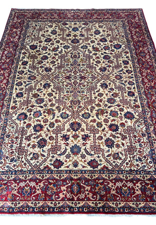 Full detailed view of the Persian Isfahan rug's pattern, emphasizing the dense floral motifs and dark outlines.