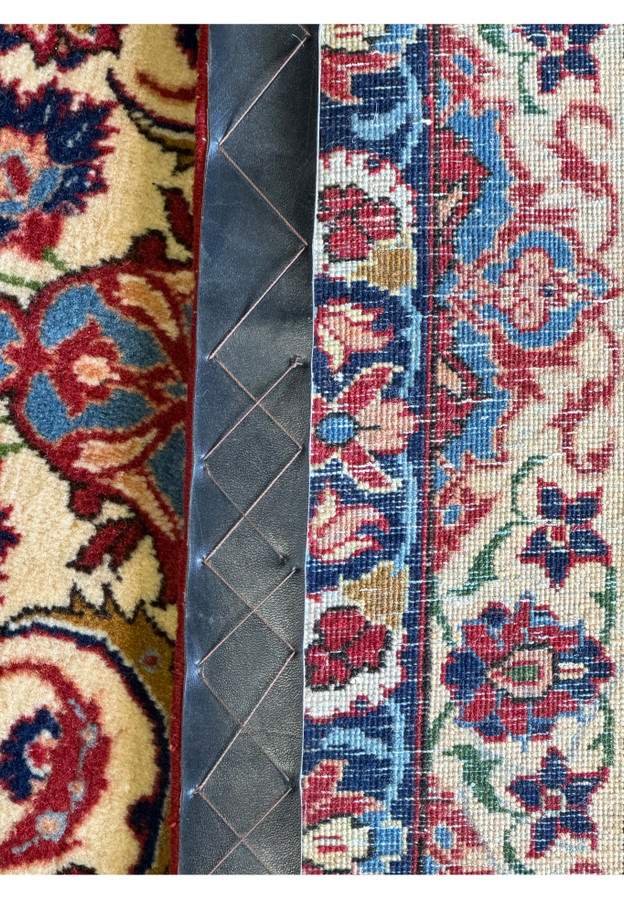 Detailed edge view of a 10'7 x 14'7 Persian Isfahan Wool & Silk Rug, displaying the precision of the border motifs.